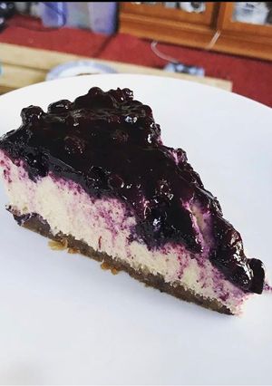A picture of Vegan Lemon & Blueberry Cheesecake (contains nuts).