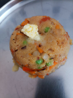 A picture of Peas/tomato Upma.