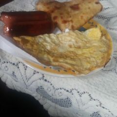 A picture of Smokie,chapati and eggs.