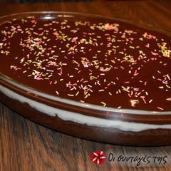 A picture of Karidopita with pudding and chocolate glaze.