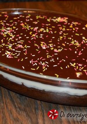 A picture of Karidopita with pudding and chocolate glaze.