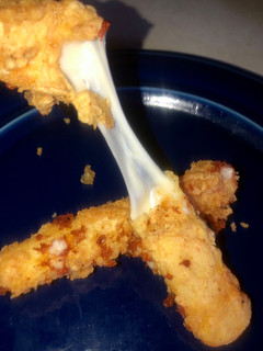 A picture of Ooey gooey cheese sticks.