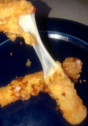 A picture of Ooey gooey cheese sticks.