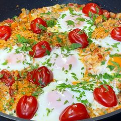 A picture of Fried Eggs with Bulgur and Tomatoes.