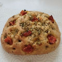A picture of Foccacia bread with rosemary.