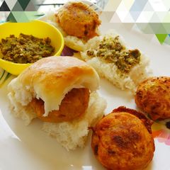 A picture of Vada pav and spicy thecha.