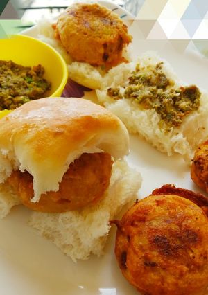 A picture of Vada pav and spicy thecha.