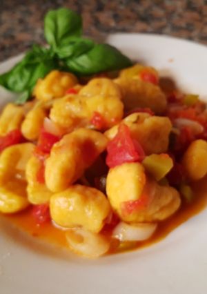 Una foto de Ñoquis de calabaza y batata