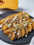 Calabaza asada con queso feta y pistacho