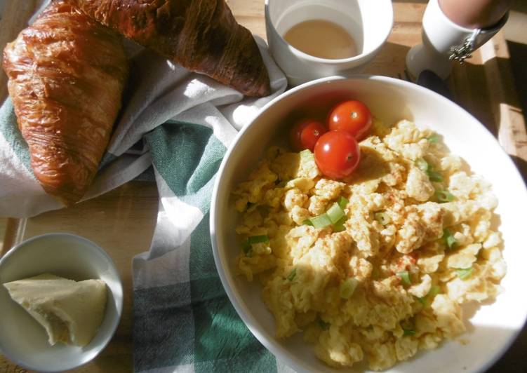 A simple morning breakfast with scrambled eggs & fresh scallions A simple morning breakfast with scrambled eggs & fresh scallions