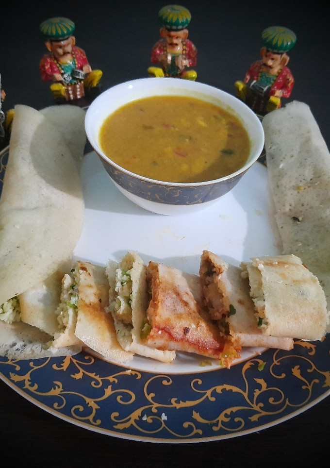 A picture of Jini dosa with sambhar.
