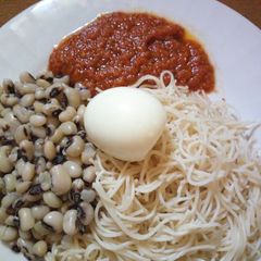 A picture of Taliya Da wake with egg and stew.
