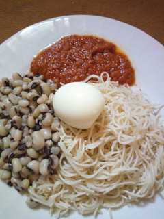 A picture of Taliya Da wake with egg and stew.