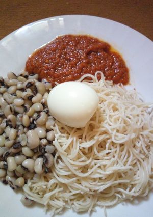 A picture of Taliya Da wake with egg and stew.