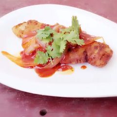 A picture of Fried Fish With Onion In Heinz Tomato And Chili Sauce.