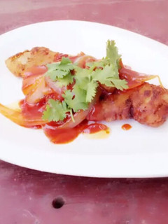 A picture of Fried Fish With Onion In Heinz Tomato And Chili Sauce.