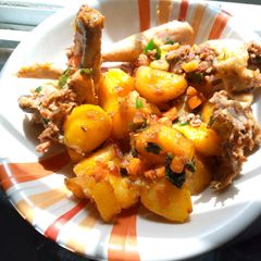 A picture of Guinea fowl and potato pot roast.