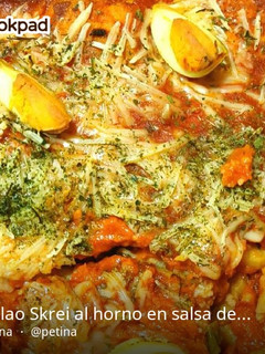 Una foto de Bacalao skrei al horno en salsa de tomate gratinado