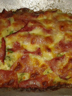 Una foto de Tarta de sobra de arroz con verduras jamón y queso mozzarella
