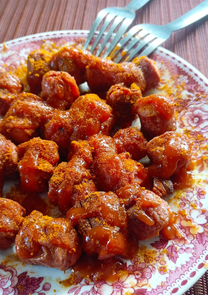 Una foto de Currywurst