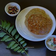 A picture of Moong Sprouts Dosa with Coconut Chutney.