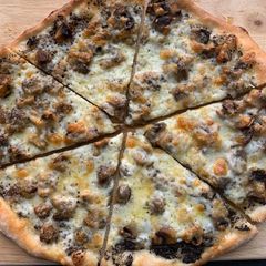 A picture of Truffled Fontina and Mushroom Pizza.