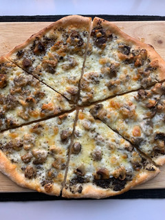 A picture of Truffled Fontina and Mushroom Pizza.