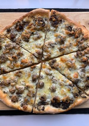 A picture of Truffled Fontina and Mushroom Pizza.