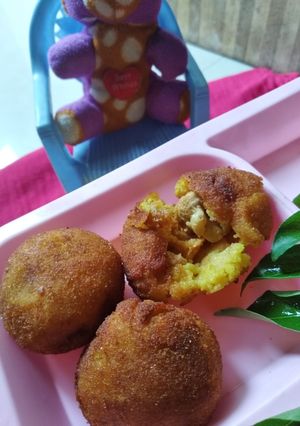 A picture of Stuffed mushroom kola urundai.