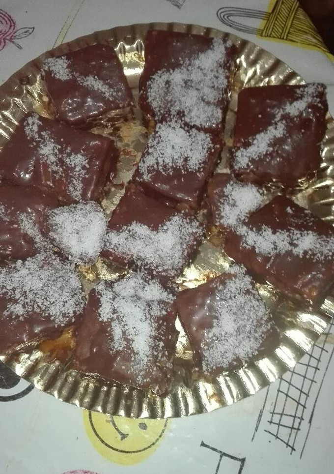 Una foto de Pastelitos crema de naranja mandarina con cobertura de chocolate 