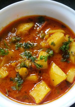 A picture of Allo Ki sabji with pressure cooker.