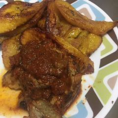 A picture of Plantain with Chicken stew.