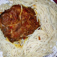 A picture of Spaghetti with sauce.