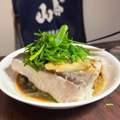 A picture of Steamed Grass carp with assorted vegetables in Cantonese style.