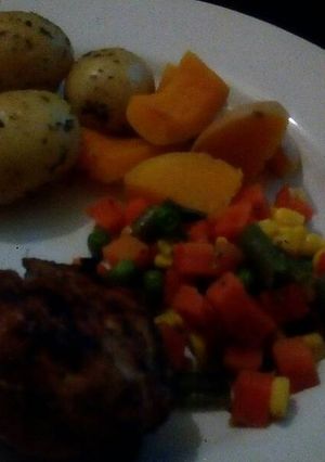 A picture of Vegetables with grilled chicken.