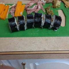 A picture of Ham, Cheese and avocado sushi.