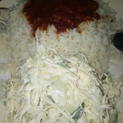 A picture of White rice and stew with simple salad.