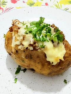 Una foto de Papas rellenas al horno/fondue de papa