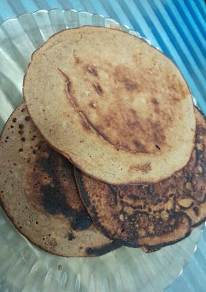 Una foto de Pancakes integrales de avena, naranja y café