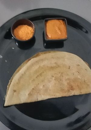 A picture of Whole Green Moong Dosa with chutney.