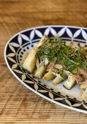 A picture of 🍆 Steamed aubergine, seasonal garnish, Japanese citrus soysauce.
