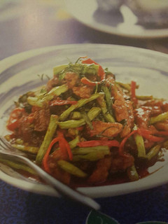 A picture of Stir-Fried pork and long beans with red curry paste.