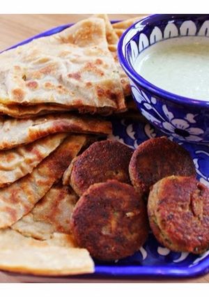 A picture of Allo ka Paratha - Potato stuffed buttered flat bread.
