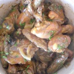A picture of Roast chicken in orange jus.