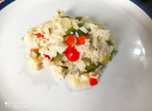 Una foto de Arroz con cebolla y pimiento