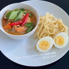 A picture of Green Curry Seafood with Tagliatelle.