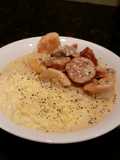 Brads Cajun prawns with sausage and grits