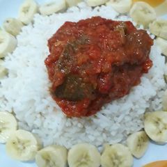 A picture of White rice soup n banana.