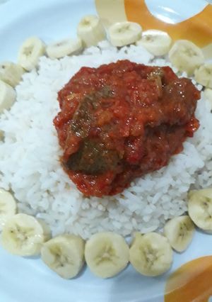 A picture of White rice soup n banana.