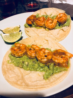 A picture of Guacamole shrimp tacos.